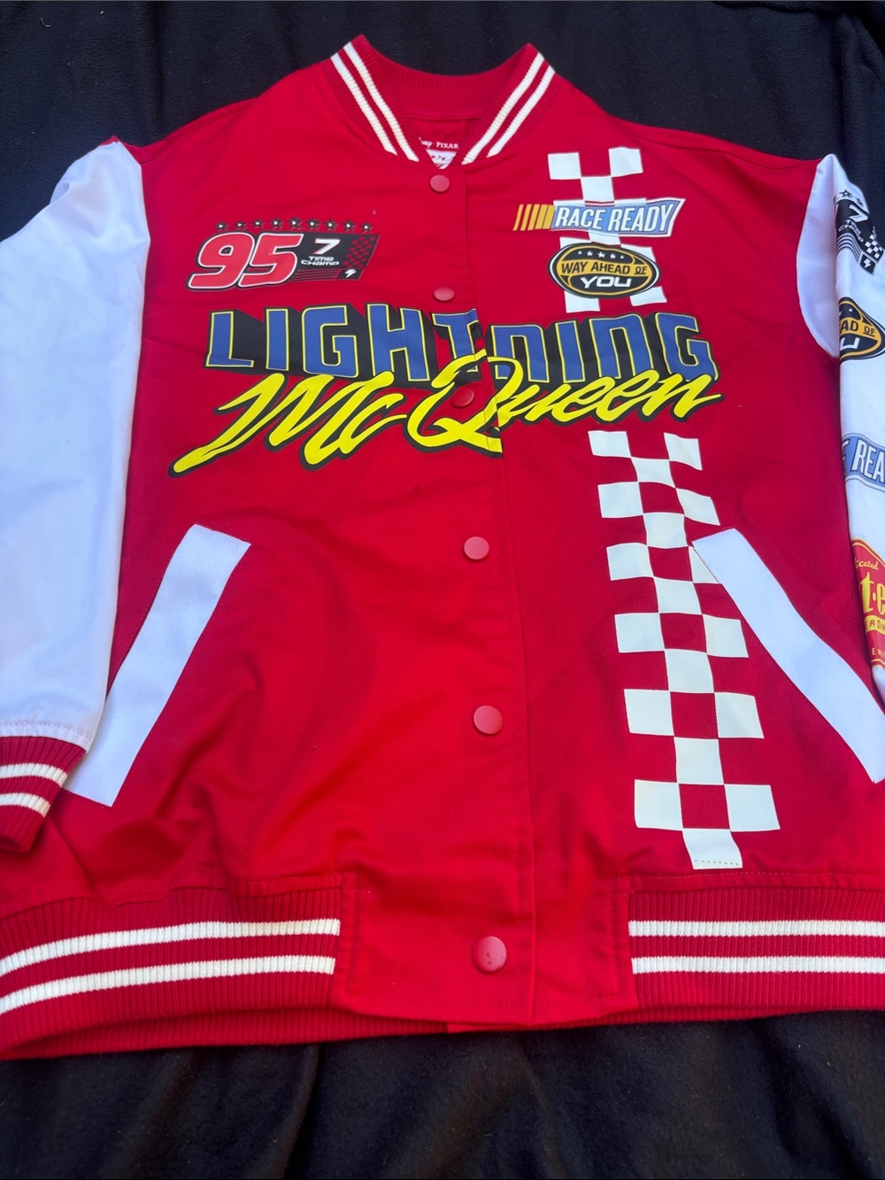Lightning McQueen Red & White Varsity Bomber Jacket. All colors vibrant.